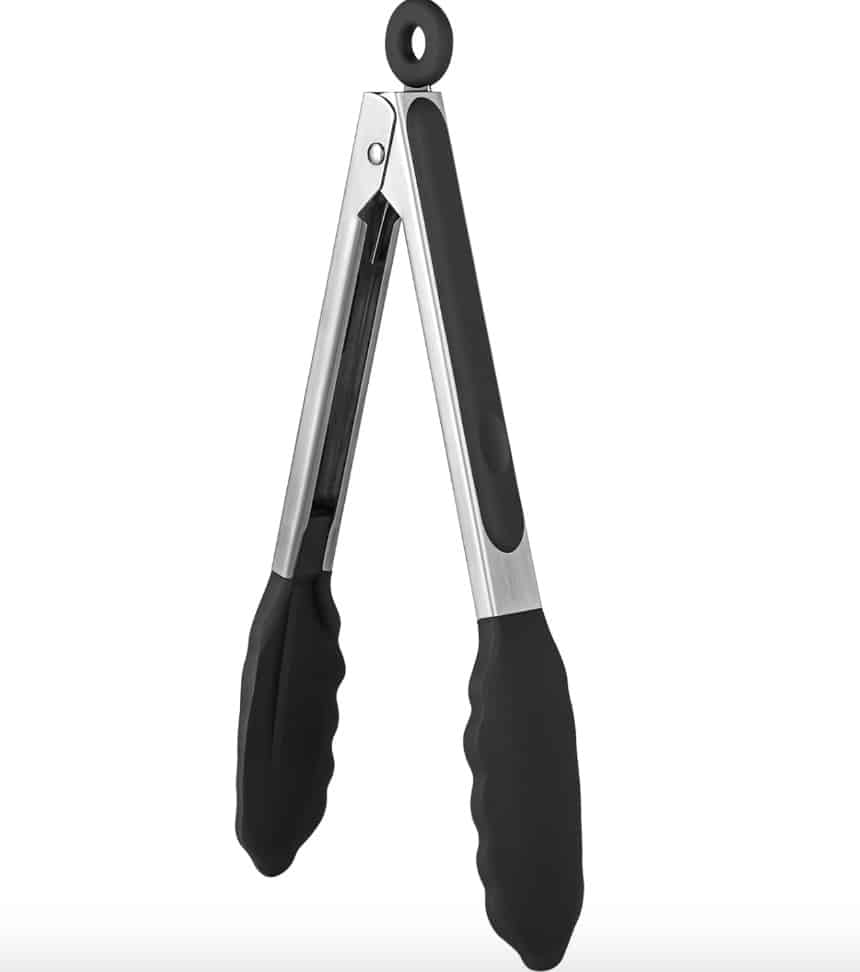 A pair of black and stainless steel kitchen tongs with silicone grips, perfect for serving your favorite baked apple fritter recipe, resting in an upright position. The handles feature a metal loop for hanging.